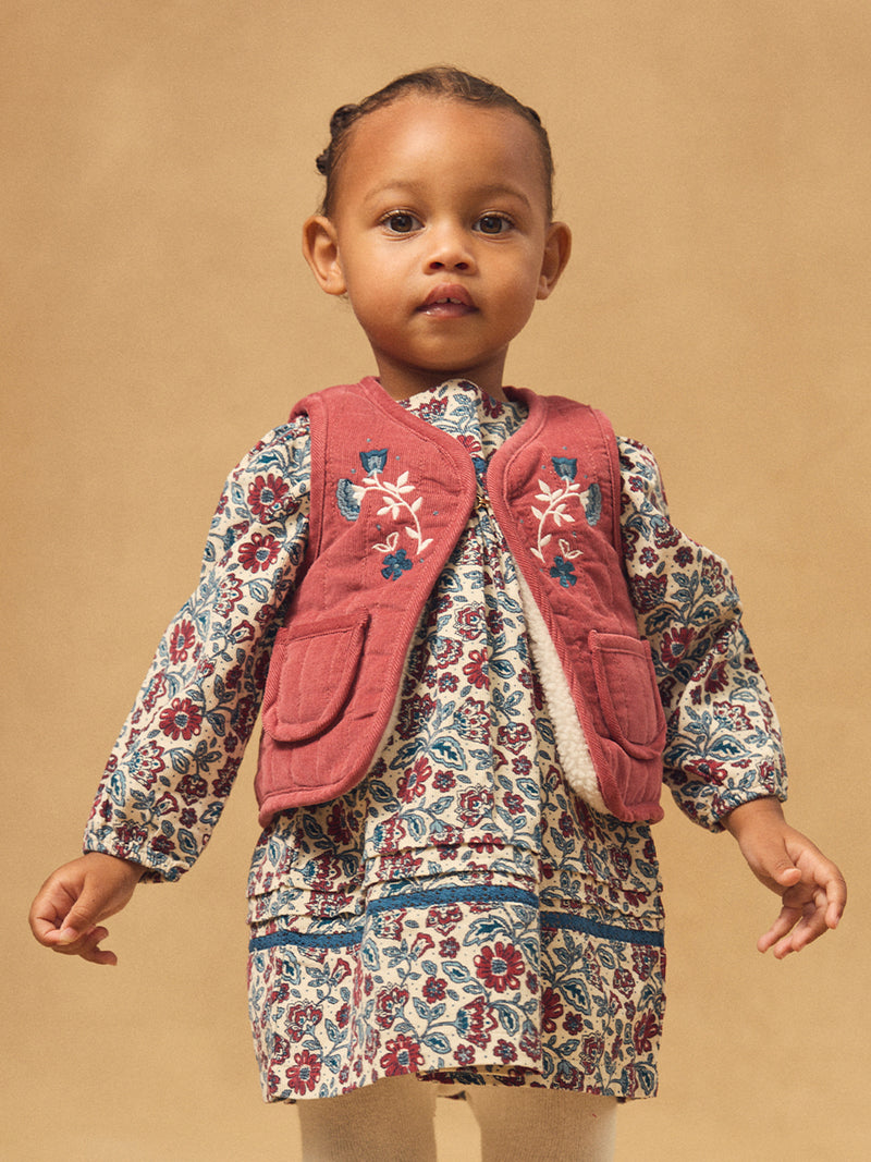 Cardigan sans manches réversible rouge ou écru Bébé Fille
